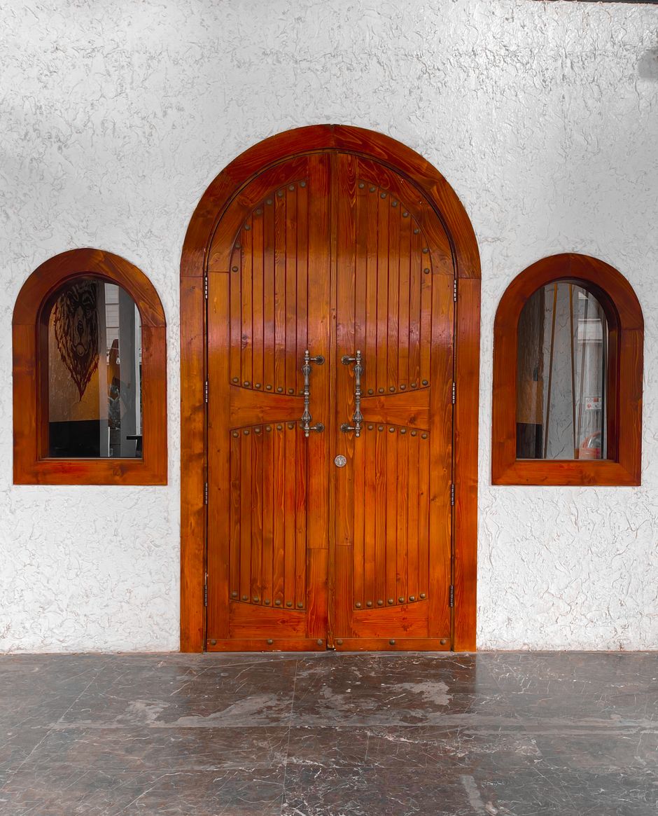 Original carved teak doors, rehung during the restoration